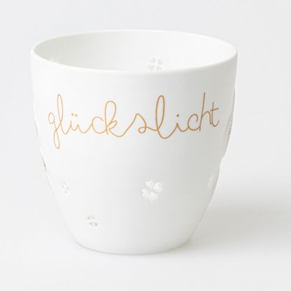 feiner Teelichthalter aus Porzellan " Glückslicht " von räder design