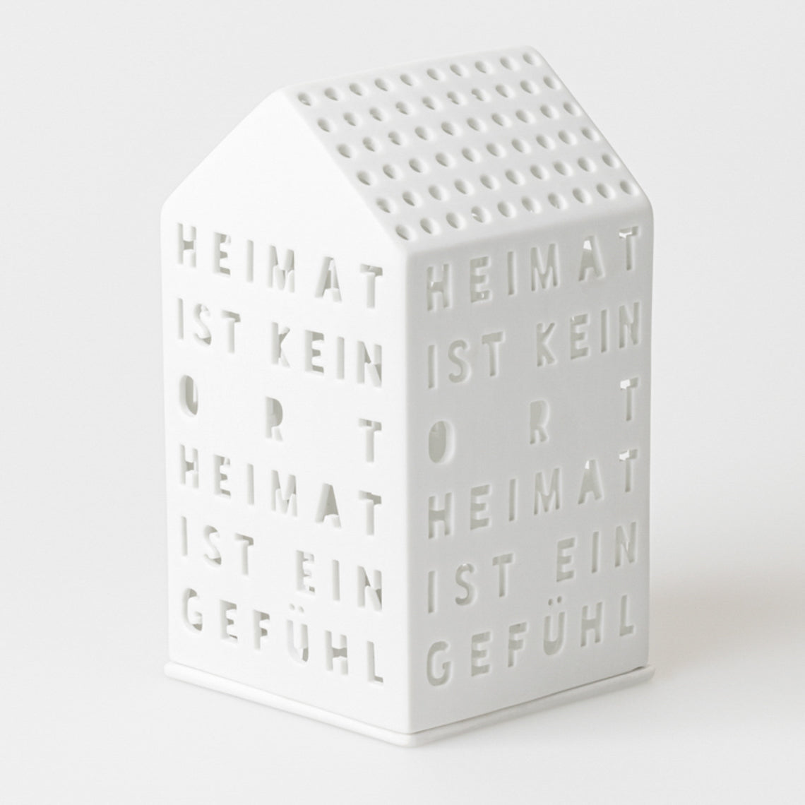 Lichthaus aus Porzellan "Heimat ist kein Ort, Heimat ist ein Gefühl" von räder design