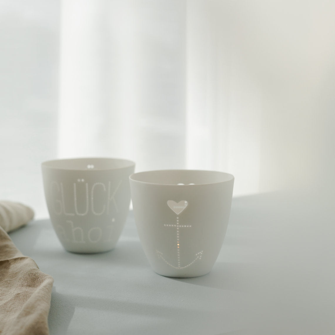 feiner Teelichthalter aus Porzellan " Herzanker " von räder design Anker & Herz